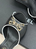 CC Classic Rhinestone Double C Bow Kitten Heel Slippers Black in Cowhide 615815