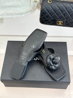 Chanel 26 Camellia Flip-Flops Black in Cowhide 706386
