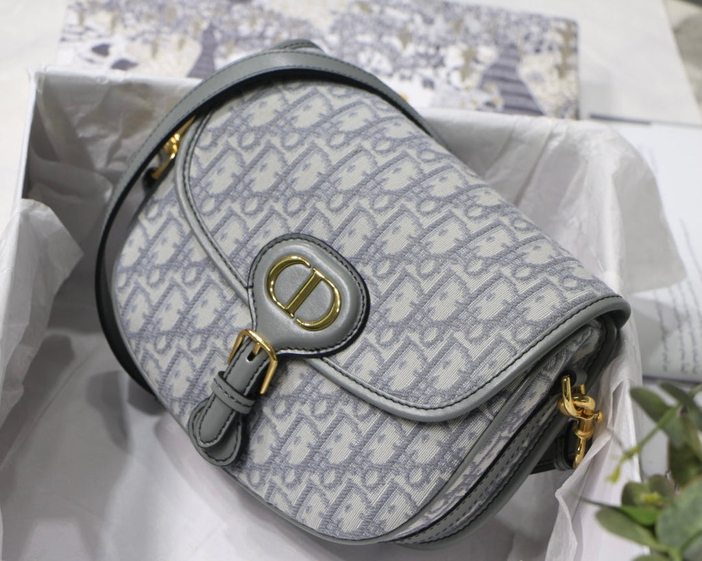 MEDIUM CD BOBBY 22CM GREY OBLIQUE CANVAS GOLD HARDWARE