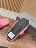 FURRY SLIDES IN PINK CURLY SHEARLING