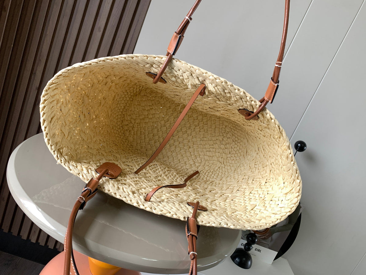 Medium anagram basket bag in iraca palm and calfskin
