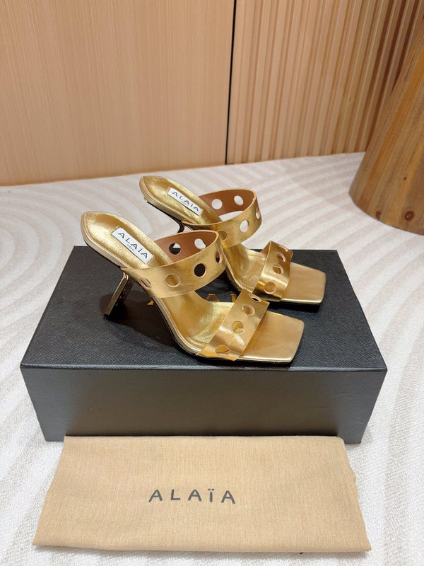 ALAIA TWO-STRAPS HIGH HEEL SANDALS IN GOLDEN PATENT LAMBSKIN