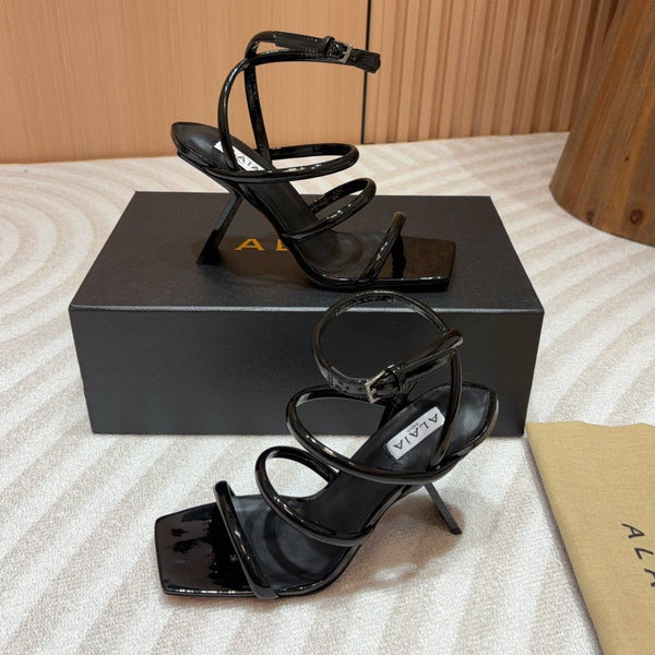 ALAIA THREE-STRAPS HIGH HEEL SANDALS IN BLACK PATENT LAMBSKIN