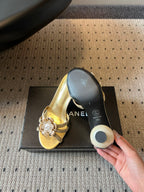 CC 2026s Pearl Camellia Sandals 7cm Gold Cowhide 719456