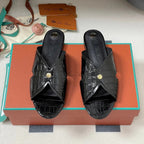FLAT SLIPPERS IN BLACK CALFSKIN SNAKE EMBOSSING