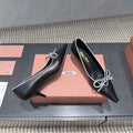 Miu 26s Pointed Toe Pumps 55mm In Black And White Calfskin With Bow