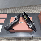 Miu 26s Pointed Toe Pumps 55mm In Black And White Calfskin With Bow
