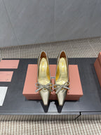 Miu 26s Pointed Toe Pumps 55mm In Gold Calfskin With Bow