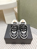 Chanel 26s Thick-Sole Sneakers In Black And White Calfskin With Fur Lining