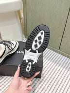 Chanel 26s Thick-Sole Sneakers In White And Black Calfskin With Fur Lining