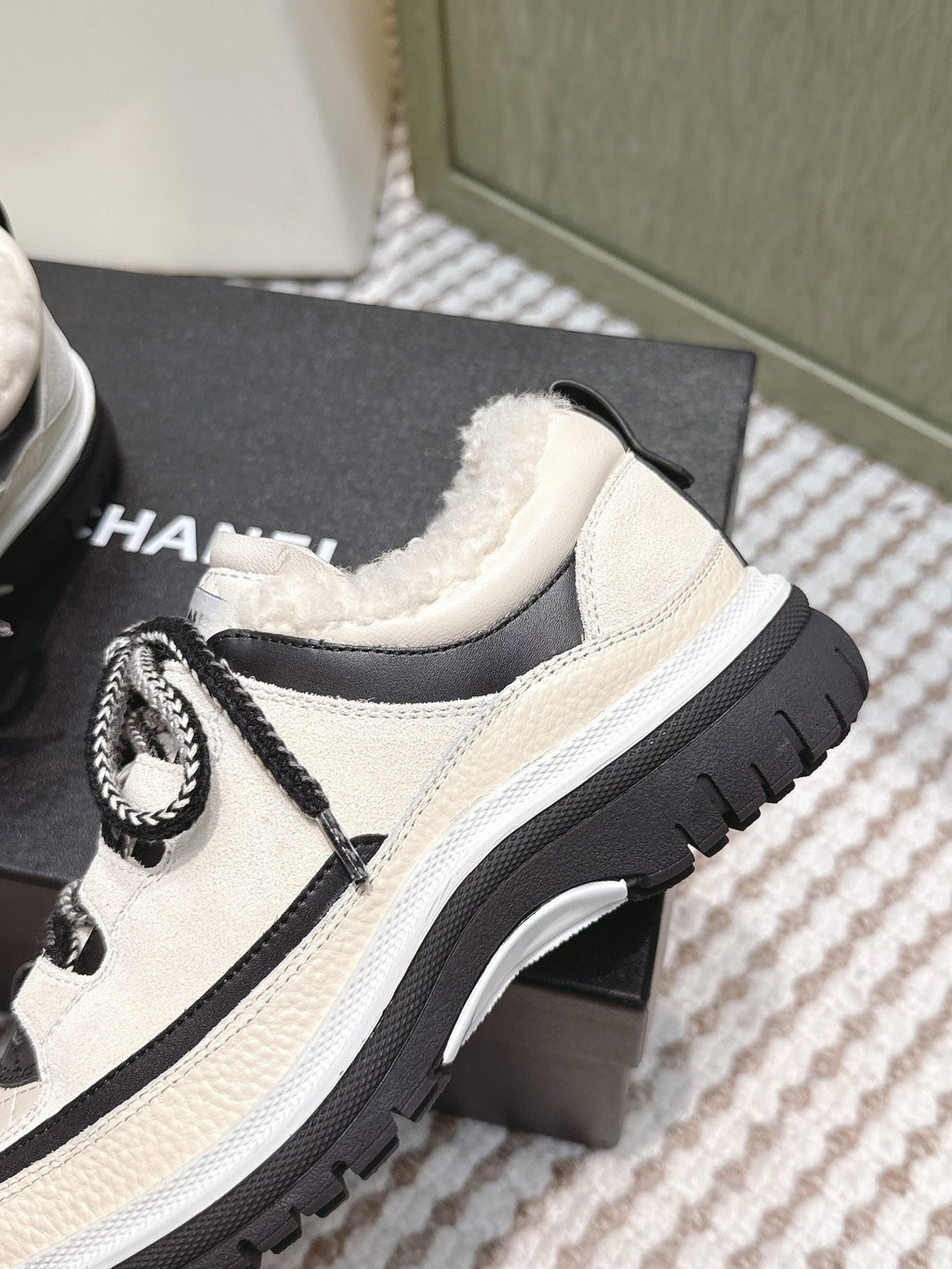 Chanel 26s Thick-Sole Sneakers In White And Black Calfskin With Fur Lining