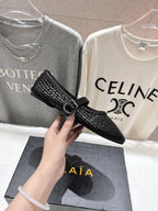 ALAIA MARY JANE FLATS black woven calfskin pattent