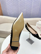 ROCKSTUD FLAT PUMP IN BLACK CALFSKIN