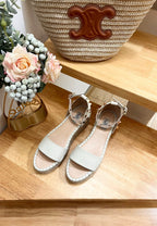 ROCKSTUD FLATFORM SANDAL IN WHITE CALFSKIN