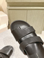 The Row Hugh Slides Black Cowhide Rubber 451281