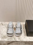 Alaia 2025 Vienne Cutout Kitten-Heel Slide Sandals Silver Leather 293647