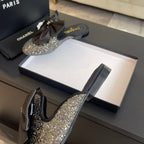 BIG BOW FLAT MULE SANDALS IN BLACK SILK WITH GLITTER SEQUINS