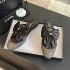 BIG BOW FLAT MULE SANDALS IN BLACK SILK WITH GLITTER SEQUINS