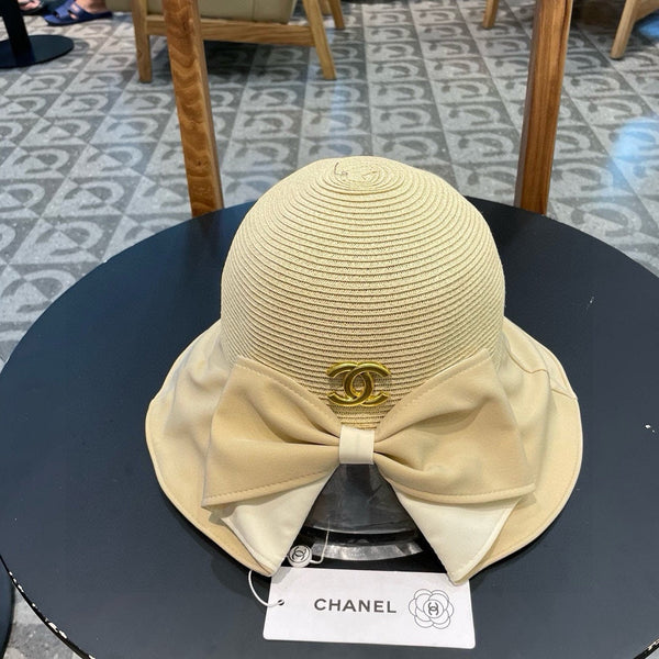 BOW BUCKET HAT IN EGG NOG BEIGE RAFFIA 426170