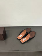 ALAIA FLAT MULES IN BLACK MESH FISHNET