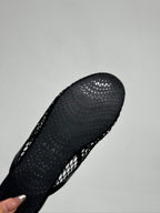 ALAIA FLAT MULES IN BLACK MESH FISHNET