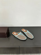 ALAIA FLAT MULES IN LIGHT BLUE MESH FISHNET