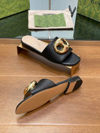 FLAT MULE IN BLACK CALFSKIN