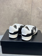 Chanel 26s Sneakers In Black And White Quilted Calfskin CC Logo