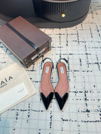ALAIA FLAT SLINGBACK IN BLACK PATENT CALFSKIN AND FILM