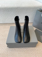 ANKLE BOOTS IN BLACK LOGO EMBOSSED SOFT SHEEPSKIN