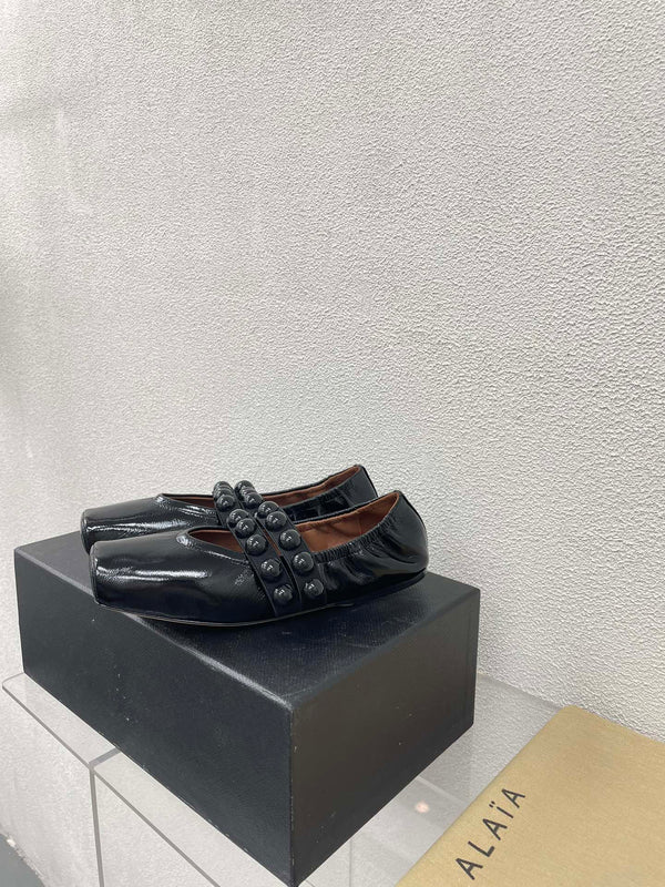 ALAIA MARY JANE PEARL IN GLOSSY BLACK LAMBSKIN