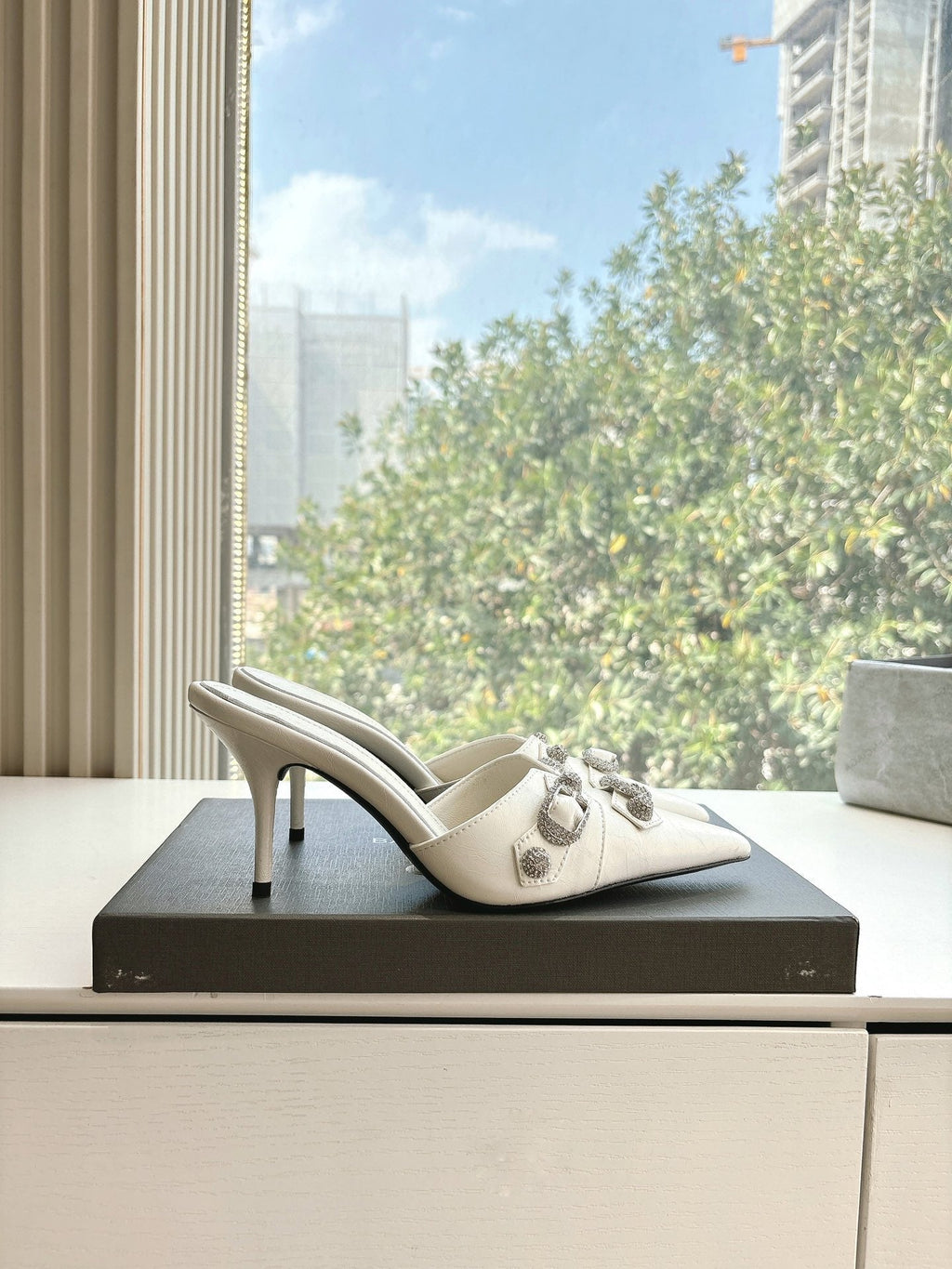CRYSTAL BUCKLE WHITE CALFSKIN HEELED MULES