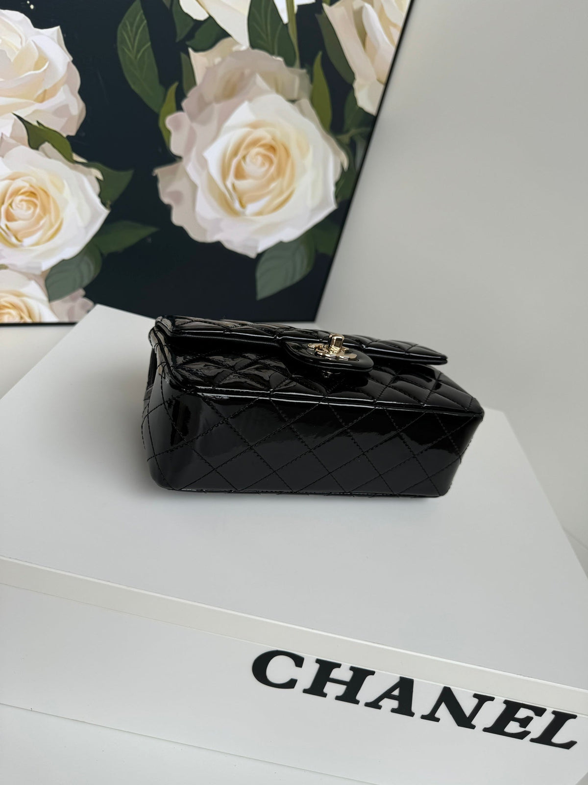 24c mini flap bag 20cm with top handle black patent calfskin