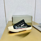 SNEAKER MULES IN BLACK CANVAS GRAFFITI LOGO