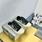 SNEAKER MULES IN BLACK CANVAS GRAFFITI LOGO