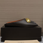 ALAIA FLAT MULE IN BLACK LAMBSKIN WITH GOLD HARDWARE