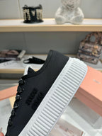 Miu logo-patch sneakers 45mm Black Canvas 456831