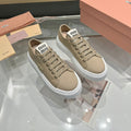 Miu logo-patch sneakers 45mm Dark Sand Canvas 456832