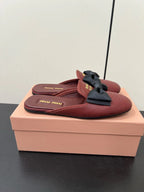 BOW MULES IN RED BROWN SHEEPSKIN