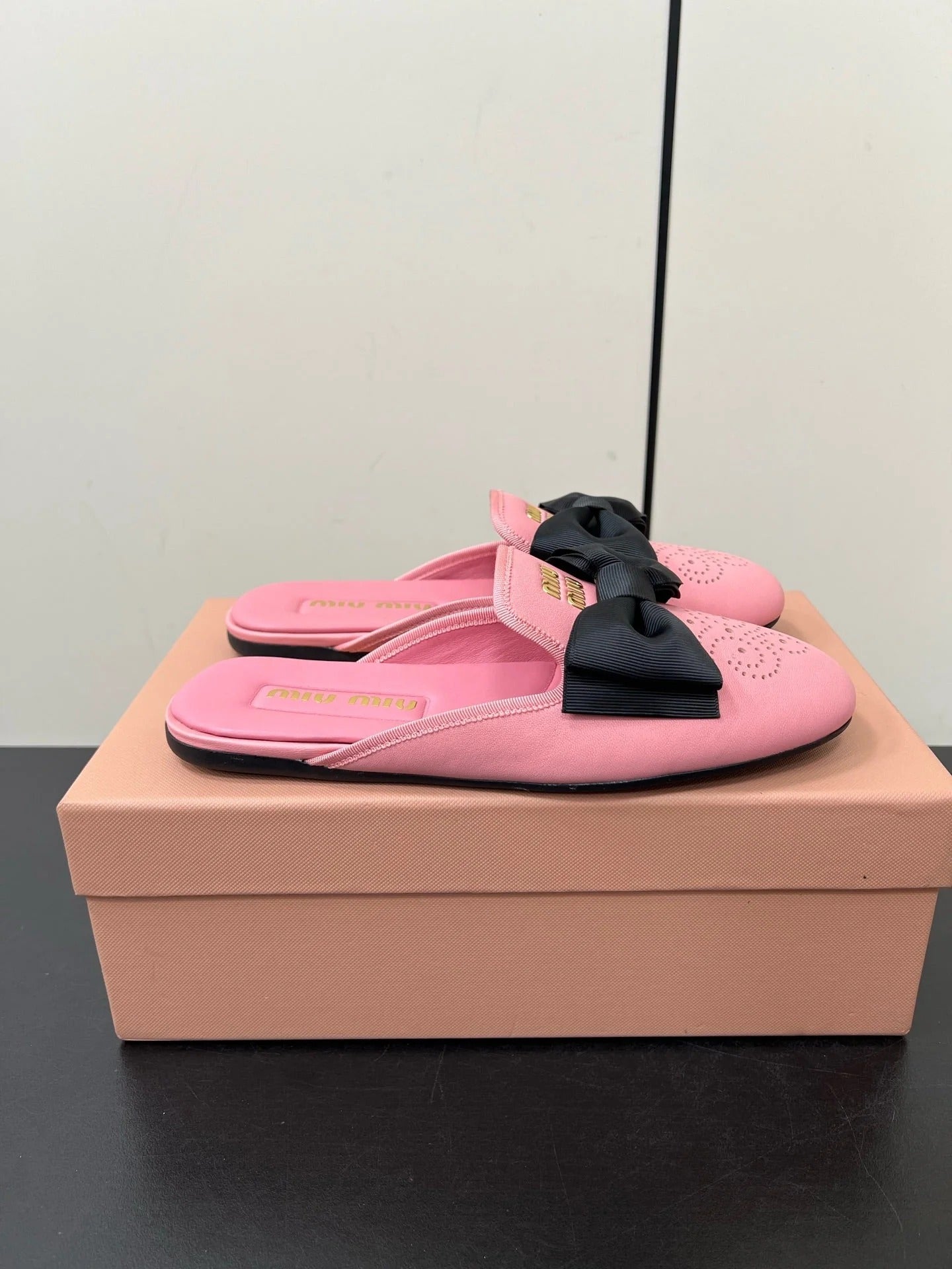 BOW MULES IN PINK SHEEPSKIN