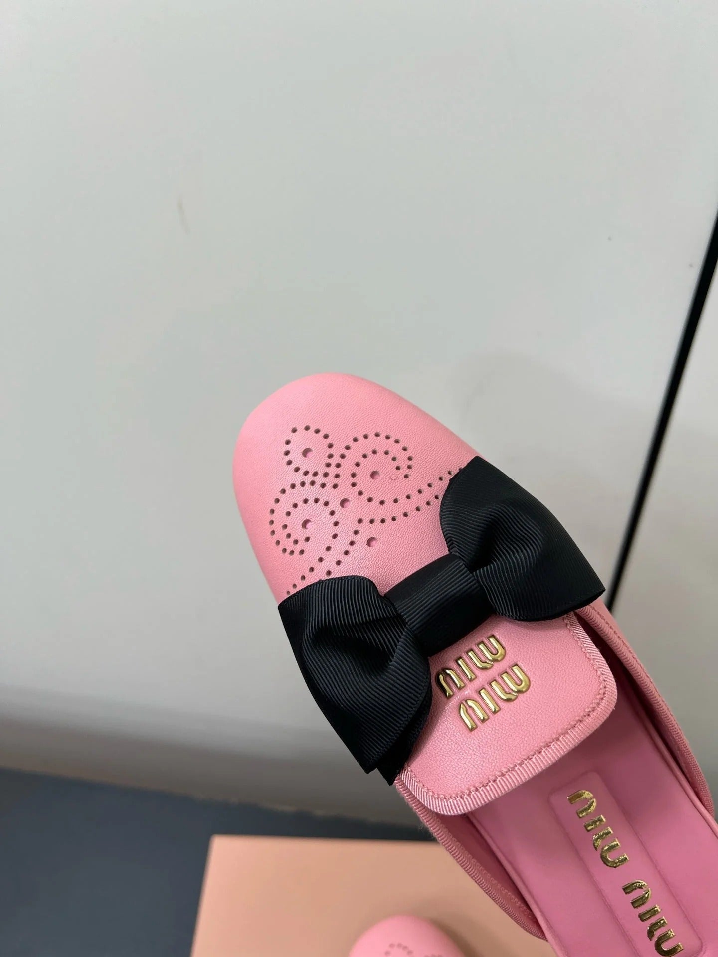 BOW MULES IN PINK SHEEPSKIN