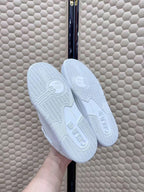 Celin Low Lace-Up Trainers in White PVC Leather