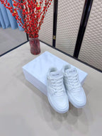 Celin Low Lace-Up Trainers in White PVC Leather